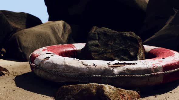 Old Broken Lifebuoy on Sea Beach