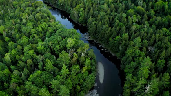 Aerial shot over Piscataquis River at Barrel Falls.