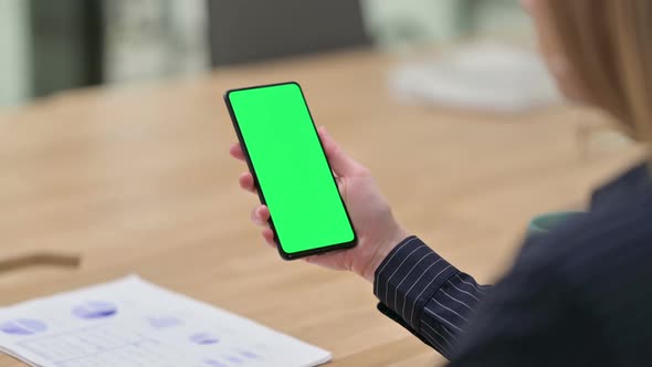 Rear View of Businesswoman Using Smartphone with Chroma Screen