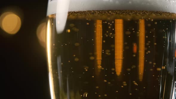 Close Up of Beer Bubbles Lifting Up in a Glass