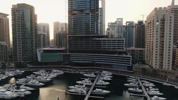 Luxury Yachts Docked in Dubai Creek Docks Near Massive Skyscrapers Luxury