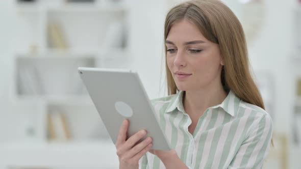 Portrait of Attractive Young Woman Using Digital Tablet