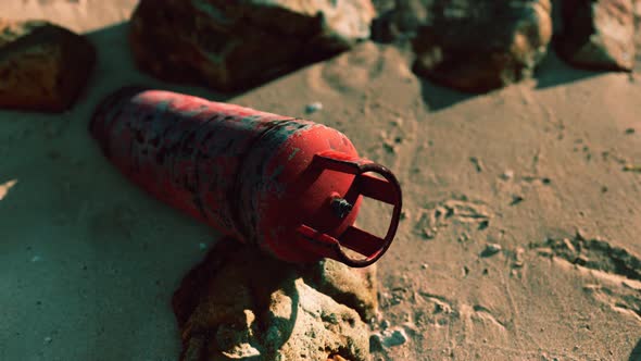 Old Rusted Gas Tank on Sand Beach