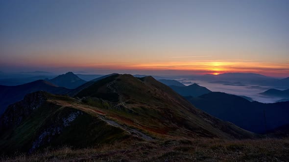 Sunrise over alpine autumn landscape.