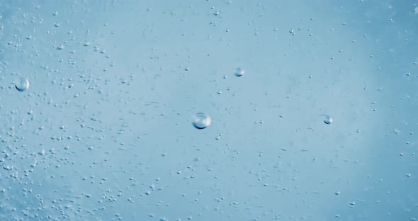 Oxygen Bubbles in Water on a Blue Abstract Background