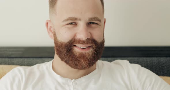 Close Up View of Cheerful Bearded Man Having Good Mood and Looking To Camera. Portrait of Handsome