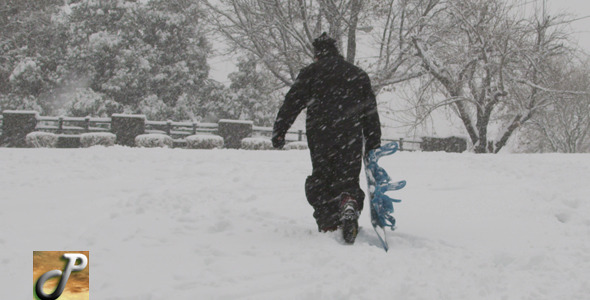 Snowboarder Walking In a Winter Storm alt