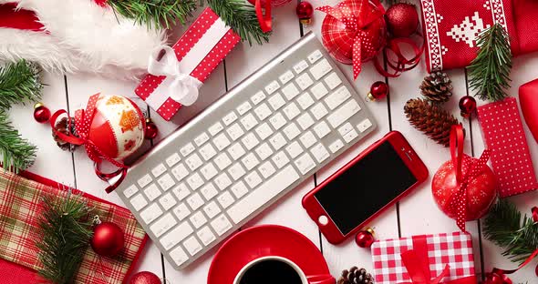 Christmas Presents and Decorations Around Gadgets and Beverage