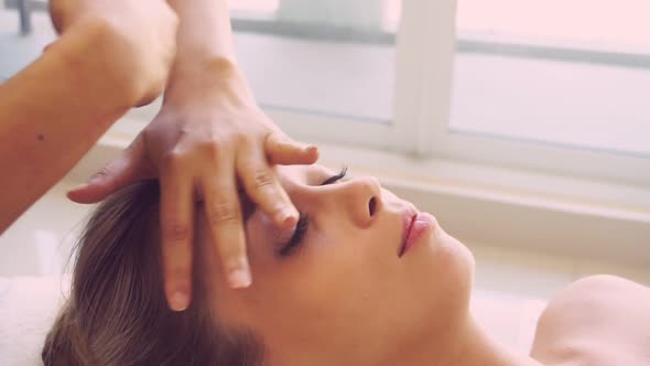 Woman Gets Facial and Head Massage in Luxury Spa