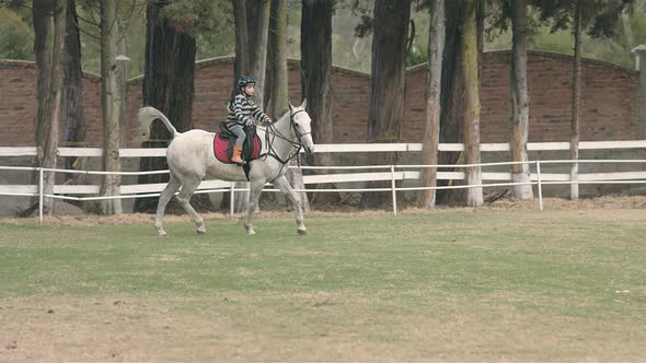 kid riding horse