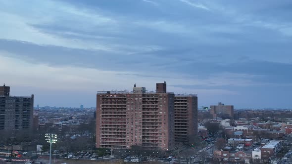 An aerial view over Calvert Vaux Park in Brooklyn, NY during a cloudy evening. The drone camera truc