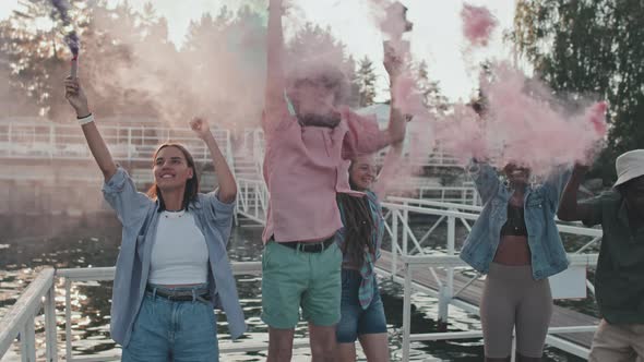 Young People with Smoke Bombs on Pier