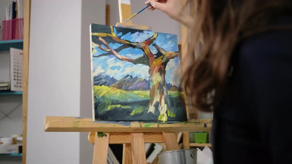 Brunette Woman Is Drawing Sky on Abstract Picture in Arttherapy Class Closeup