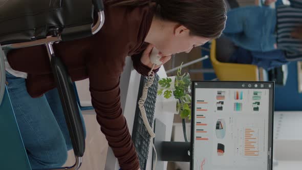 Video Vertical Busy Paralysed Handicapped Woman Worker Talking at Phone with Colleague