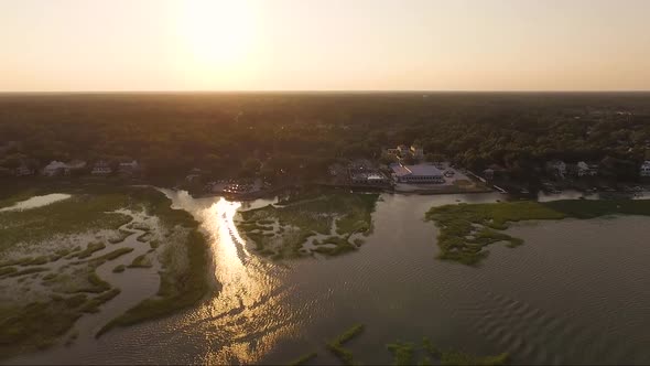 Orange sky during sunset flight over Woodland Creek in low country SC
