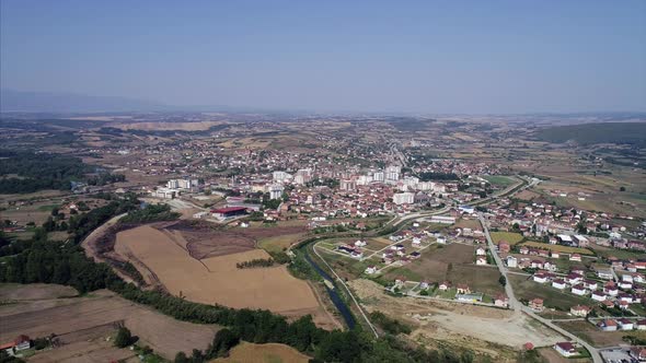 Farm Land and City Seen From a Distance in the Balkan Peninsula