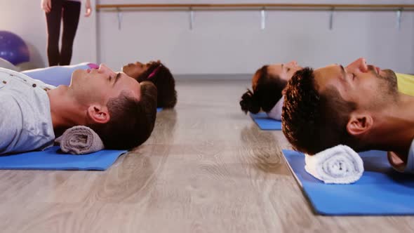 Group of people performing yoga