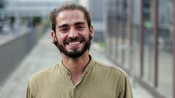 Cheerful Man Smiling at Camera