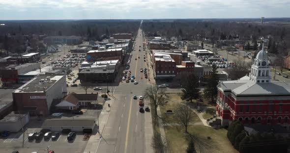 Downtown Charlotte, Michigan skyline with drone flying forward.