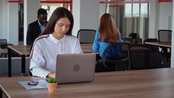 Overworked Employee Tired in Open Space Office