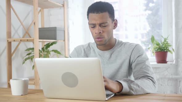 Tension Headache Frustrated AfroAmerican Man with Stress of Work