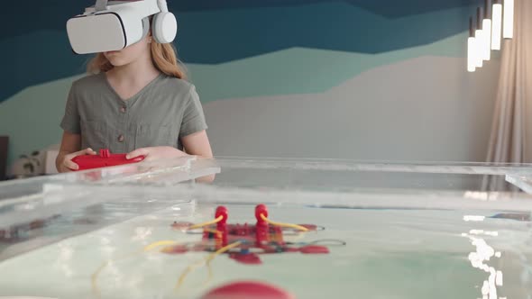 Girl Wearing VR Glasses Playing with Robo Boat