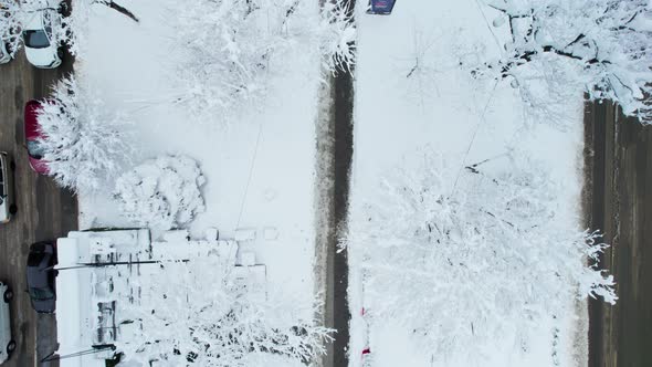 Aerial Top Down View of Snowy City Asphalt Road Landscapes in Winter