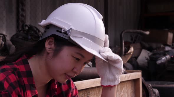 Depressed Asian Female worker or engineer portrait.