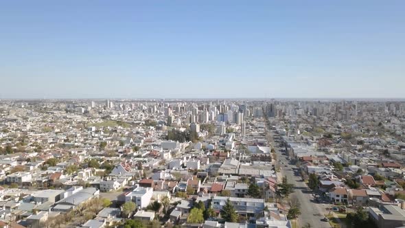 Aerial Drone shot from above the suburbs, going downtown, in Bahía Blanca, Argentina