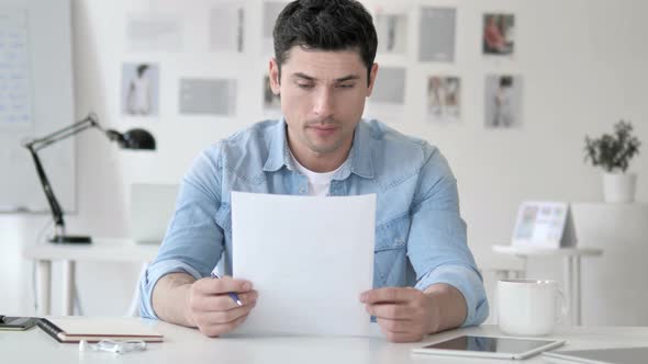 Casual Young Man Celebrating Successful Contract