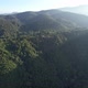 Aerial landscape view of the sun is shining through the greenery rainforest mountains by drone - VideoHive Item for Sale