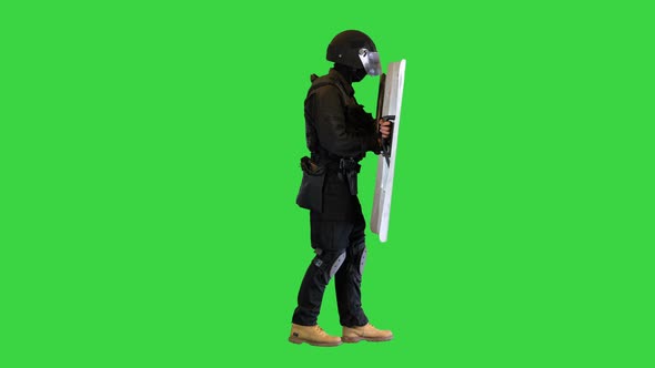 Riot Police Unit Walking with the Shield Up on a Green Screen Chroma Key