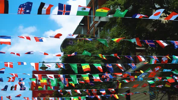 Fluttering flags of all states on the streets of the city, the unity of nations