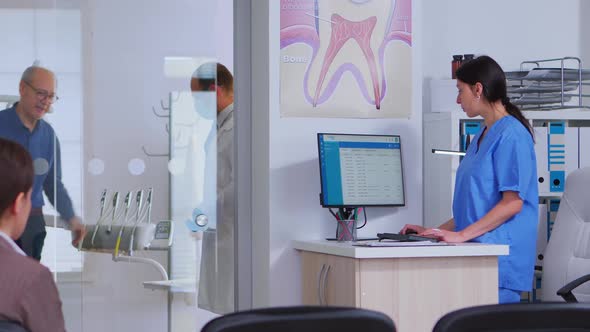 Dentist Asking Nurse for Next Dental Radiography