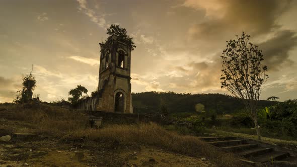 Timelapse ruin historical church in the evening with golden cloud 