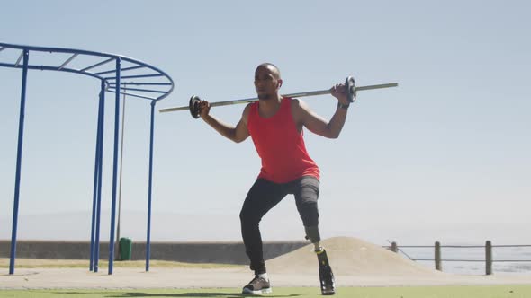 Front view man with prosthetic leg exercising