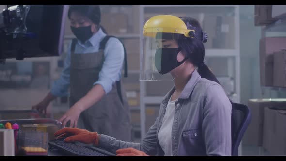 Women Checking Information About Package on Computer