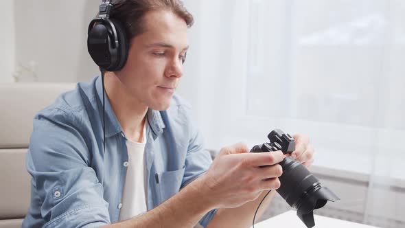 Workplace of freelance worker at home office. Young man works using computer.