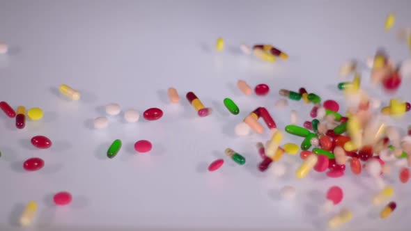 Colored Pills Falling to the Right 