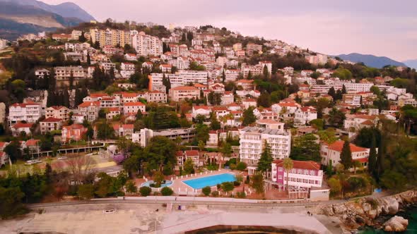 Drone Flying Above Town at Seashore