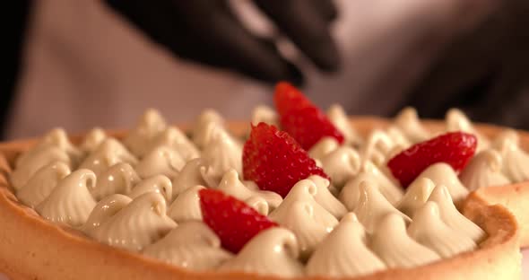 Strawberries are Put on Top of the Cream of a Cake