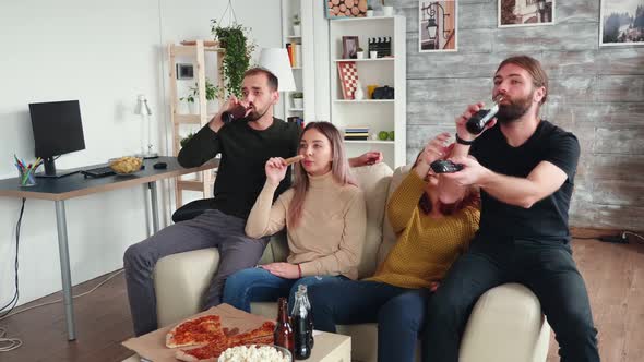 Group of Close Friends Enjoying Their Beer and Pizza