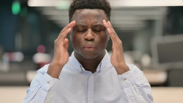 Portrait of African Businessman Having Headache