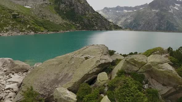 mountain lake in the swiss alps, reservoir in the middle of the mountains