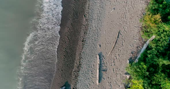 Abstract aerial view of waves crashing on the Lake Erie shoreline.