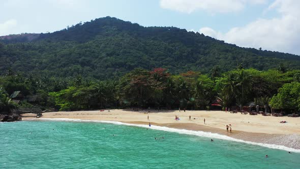 Wide angle overhead clean view of a white sand paradise beach and blue sea background in colourful 4