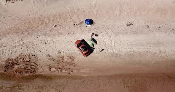 Top Down View of Solo Camping on Tropical Sandy Beach