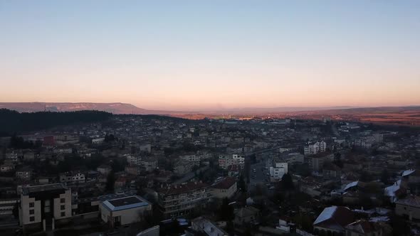 Aerial shot of Veliki Preslav, Bulgaria at sunset. Real time.