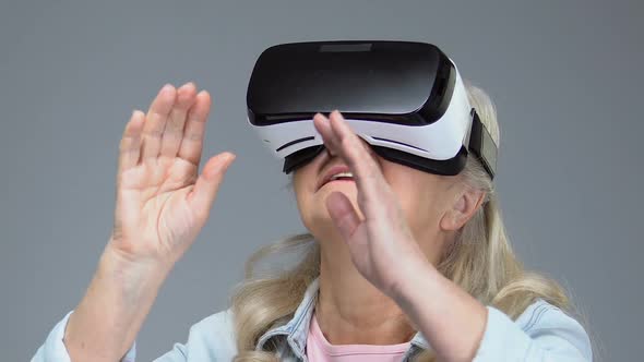 Mature Woman Wearing Virtual Reality Headset, Entertainment Device, Innovation