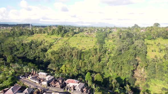 Drone over hills canyon, rice terrace and village